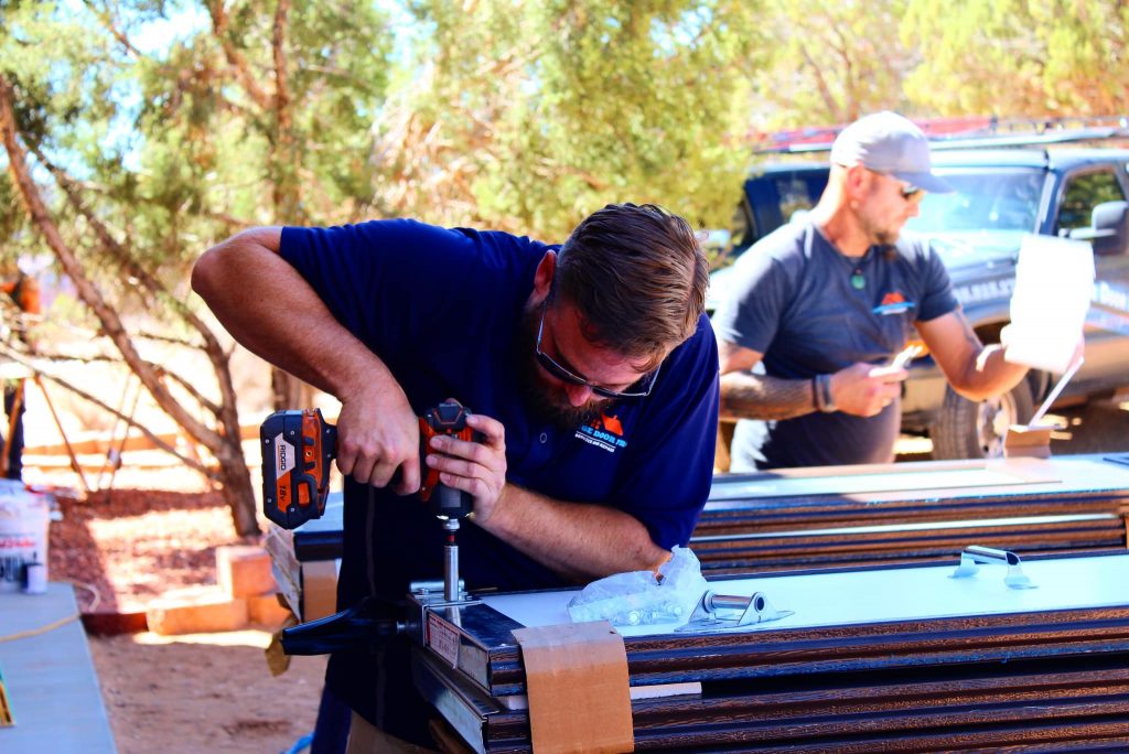 Garage Door Pros technician repairing garage door in St. George, UT - garage door repair st george